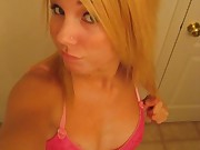 Blonde chick selfshooting in pink lingerie