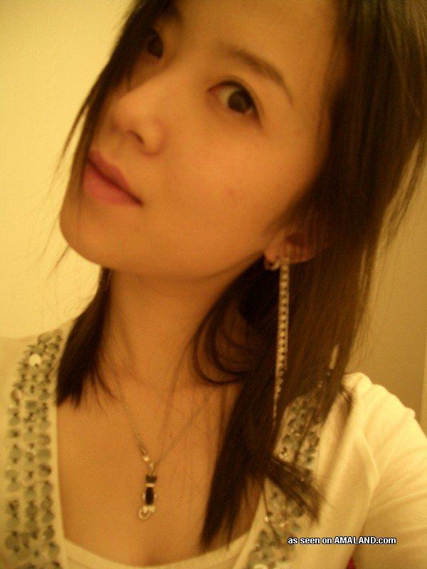 Chinese babe flashing her breasts and ass